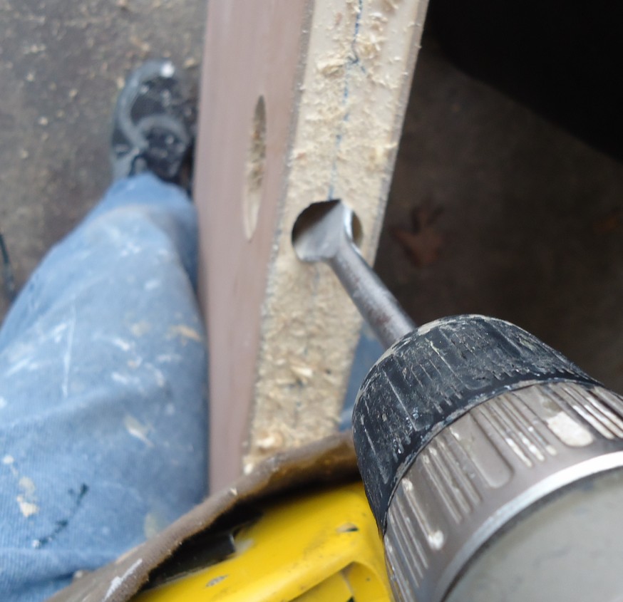 Drilling a hole in a door to install a lock